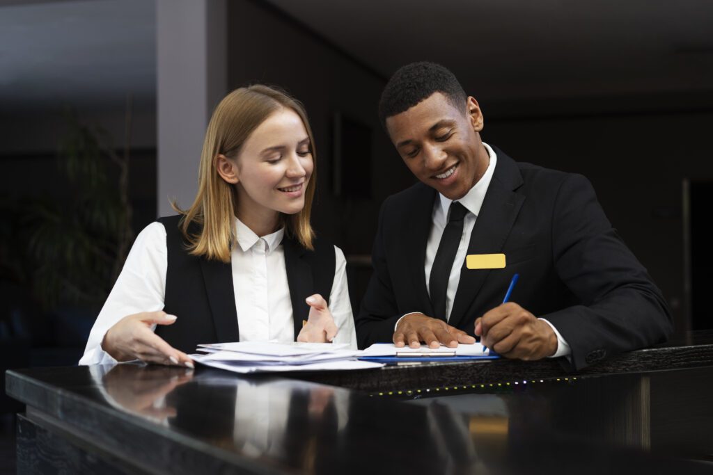 a man and woman looking at papers